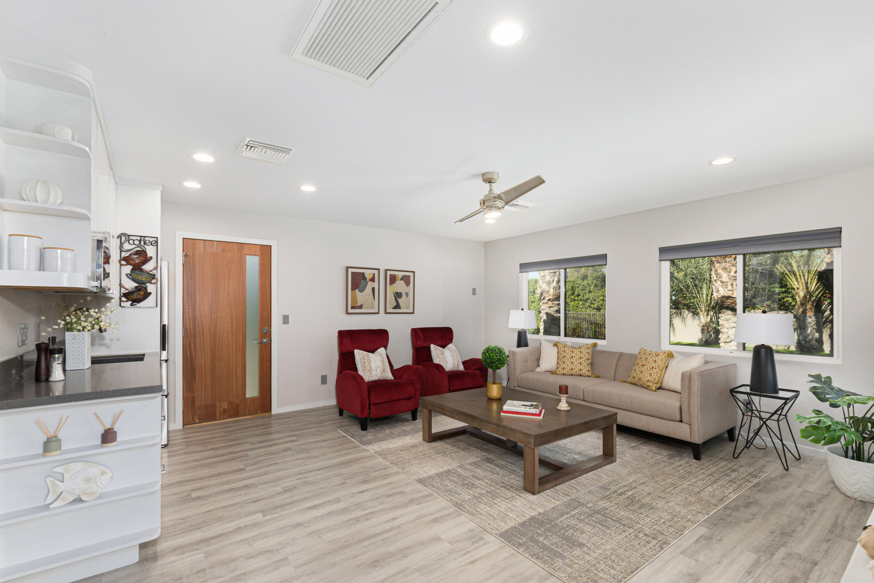74155 Mockingbird Trail Indian Wells, CA 92210 - Photo 35 of 55 a living room with furniture and a wooden floor