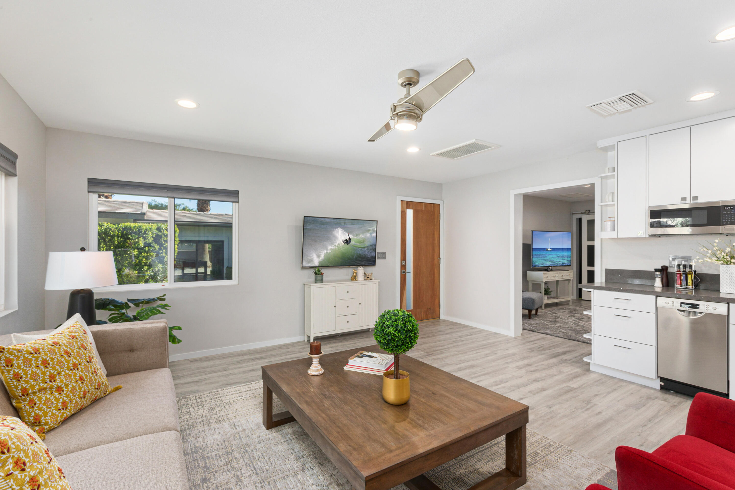 74155 Mockingbird Trail Indian Wells, CA 92210 - Photo 36 of 55 a living room with furniture kitchen view and a potted plant