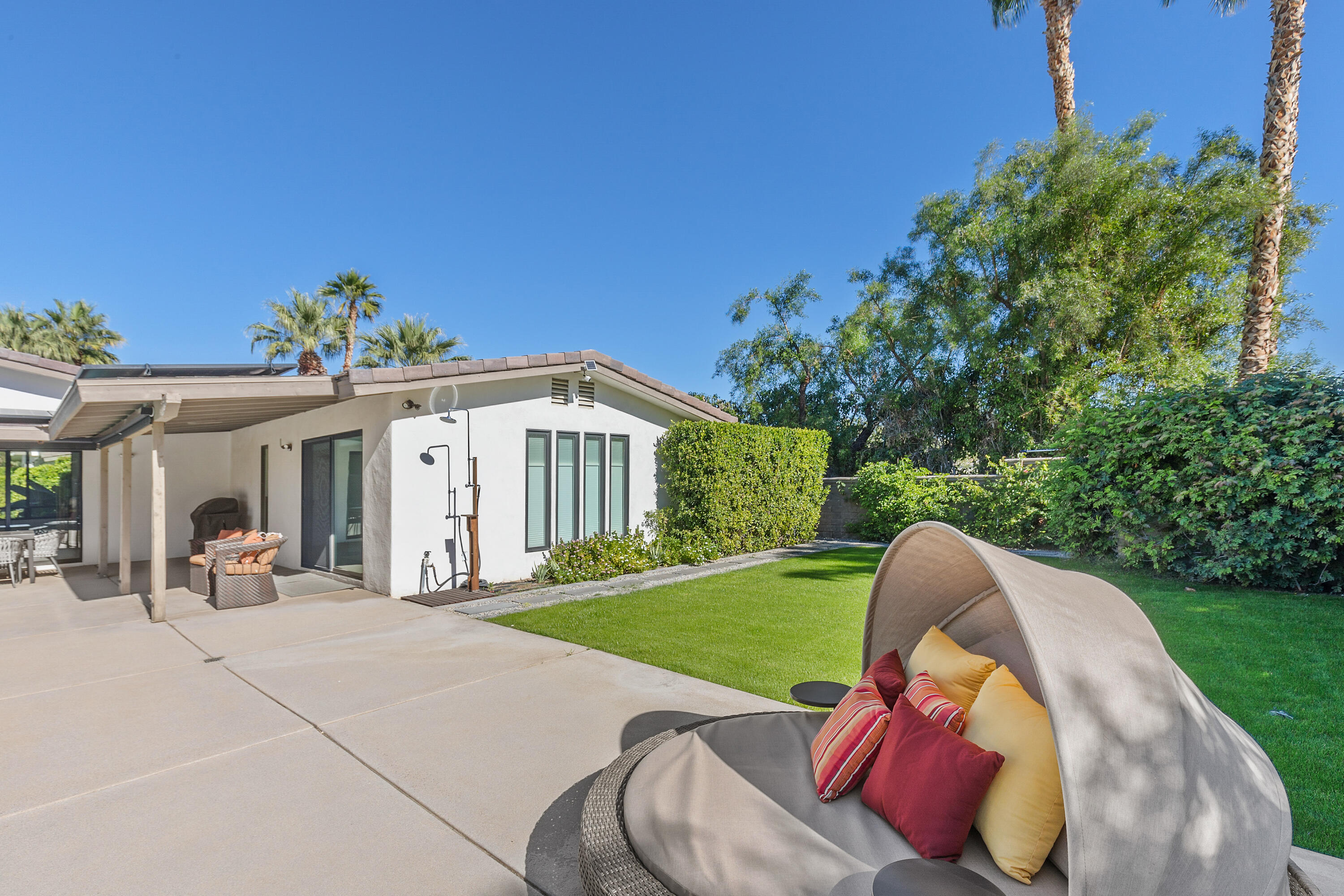 74155 Mockingbird Trail Indian Wells, CA 92210 - Photo 41 of 55 a view of a house with a backyard porch and sitting area