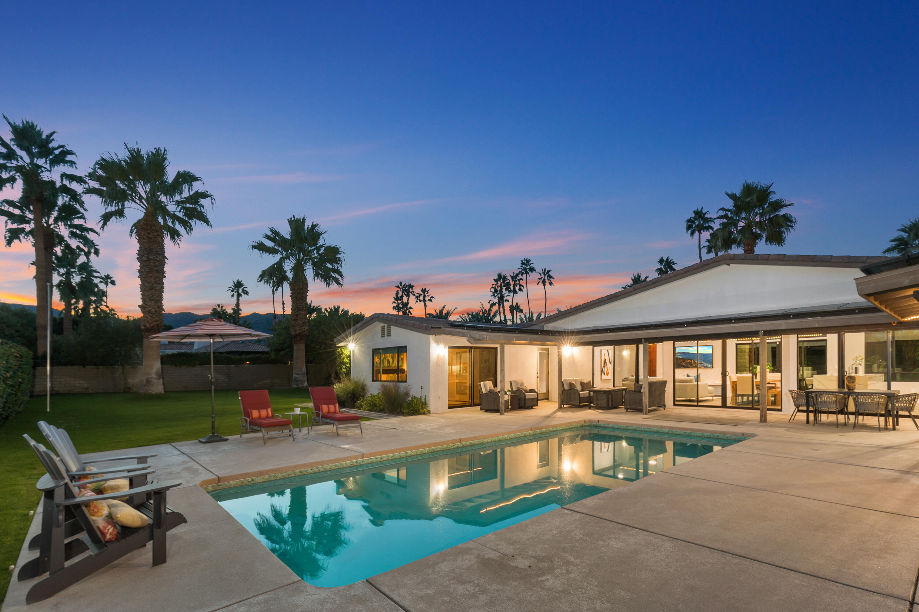 74155 Mockingbird Trail Indian Wells, CA 92210 - Photo 52 of 55 a front view of a house with swimming pool having outdoor seating