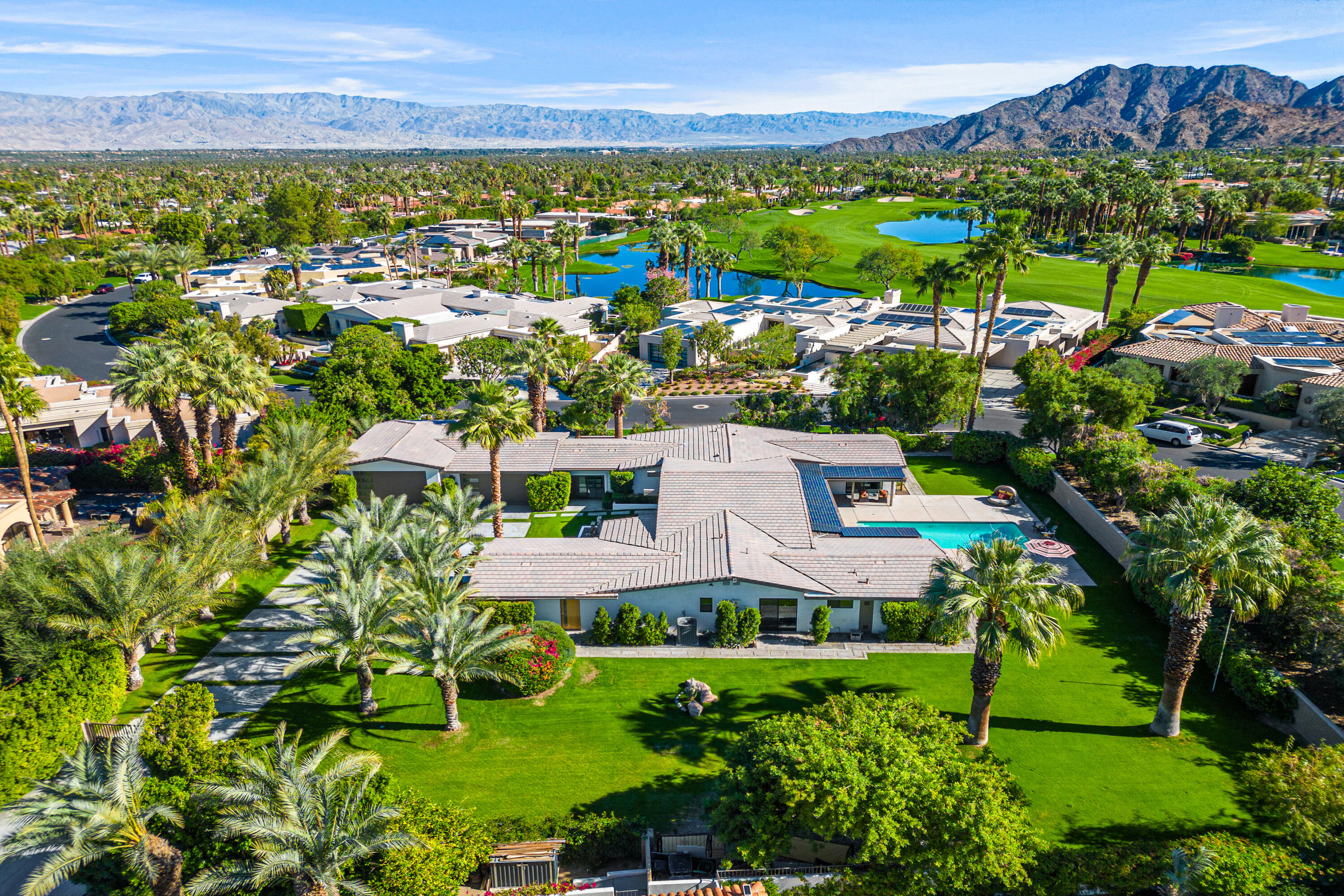 74155 Mockingbird Trail Indian Wells, CA 92210 - Photo 7 of 55 an aerial view of residential houses with outdoor space and trees