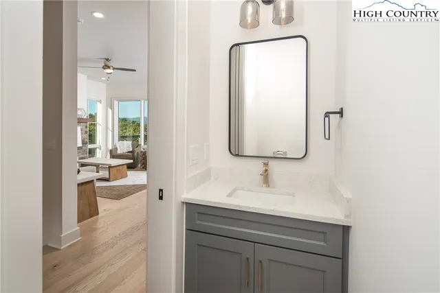 a bathroom with a granite countertop toilet sink and shower