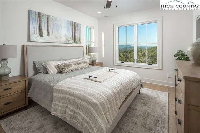 a view of a balcony with wooden floor & fence