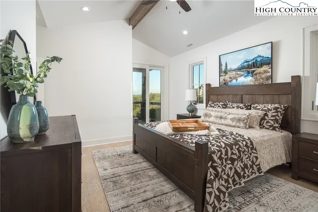 a view of a chairs and table in the balcony