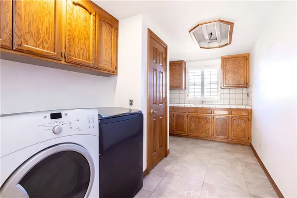 a view of a kitchen with washer and dryer