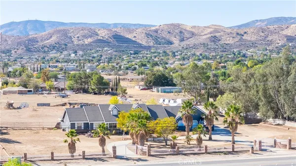 an aerial view of residential houses and outdoor space