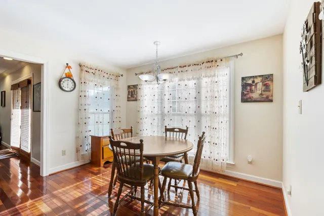 a bedroom with furniture and a large window
