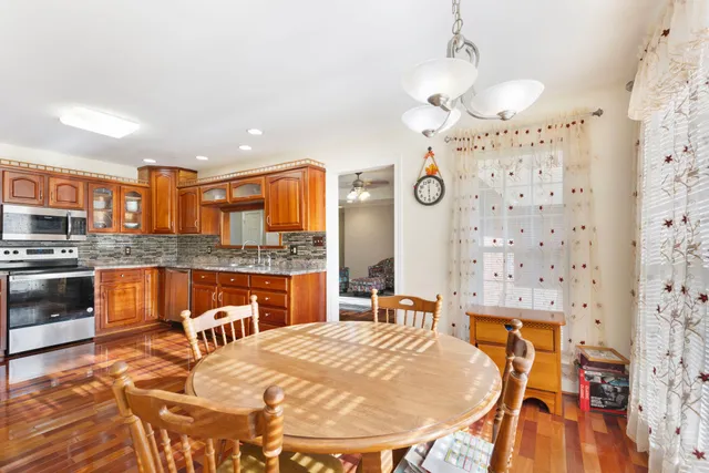 a bedroom with a bed window and a flat screen tv