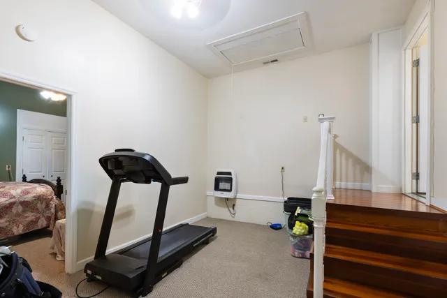 a kitchen with stainless steel appliances granite countertop a refrigerator a stove and a sink with wooden floor