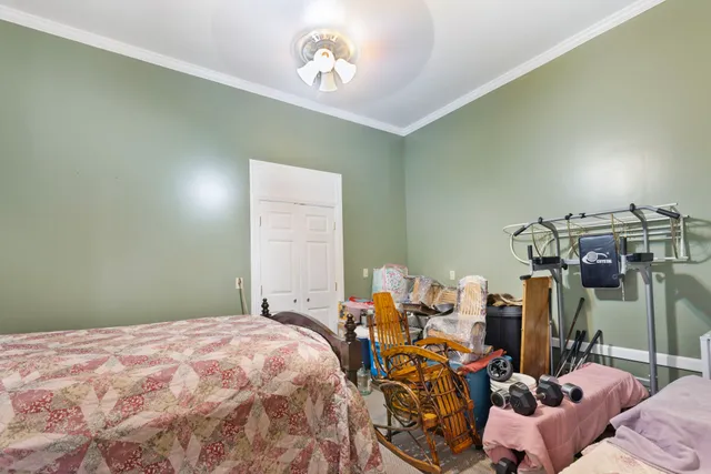 a living room with furniture a window and a chandelier
