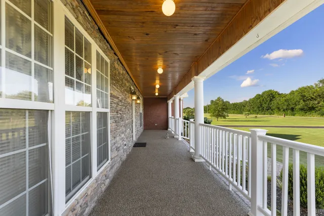 a view of a golf course with a lake view
