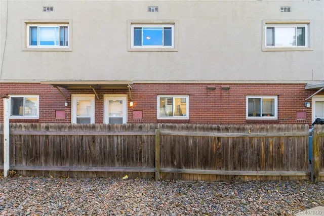 a view of a house with a fence