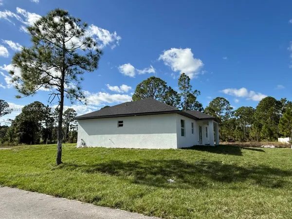 a front view of house with garden