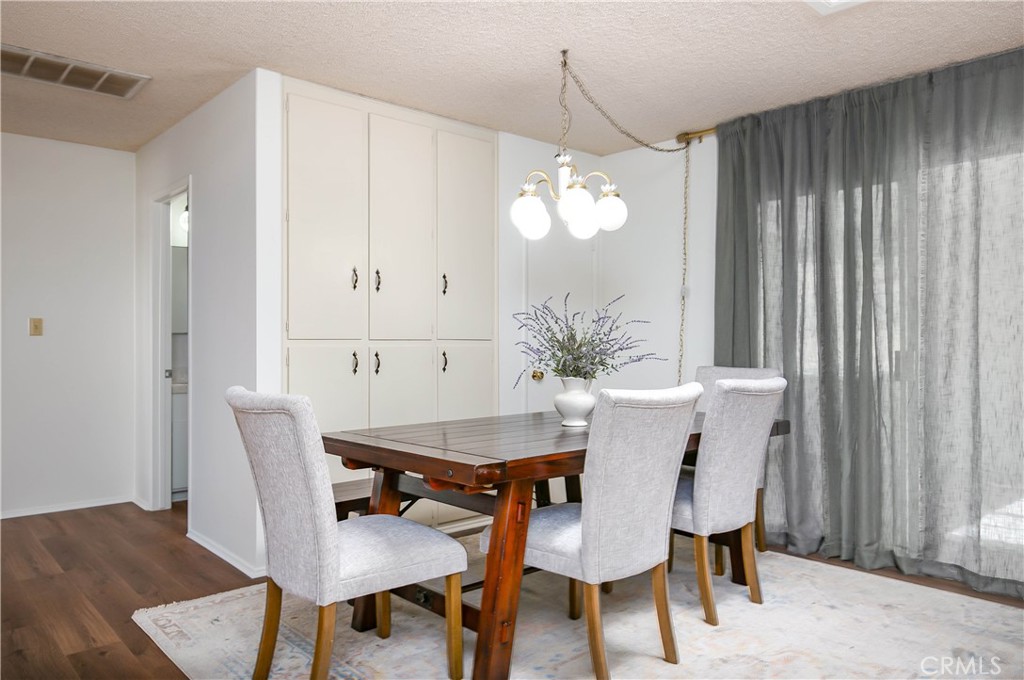 46404 Kings Canyon Road Lancaster, CA 93536 - Photo 12 of 41 a view of a dining room with furniture and chandelier