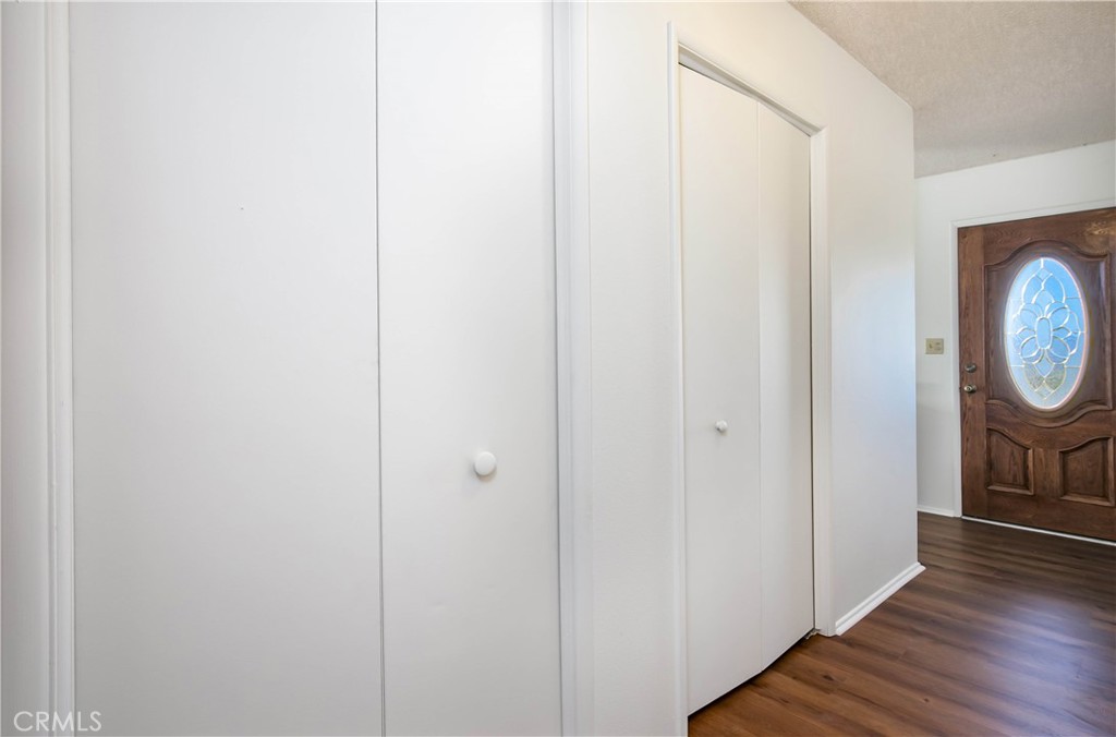 46404 Kings Canyon Road Lancaster, CA 93536 - Photo 14 of 41 a view of a hallway with wooden floor