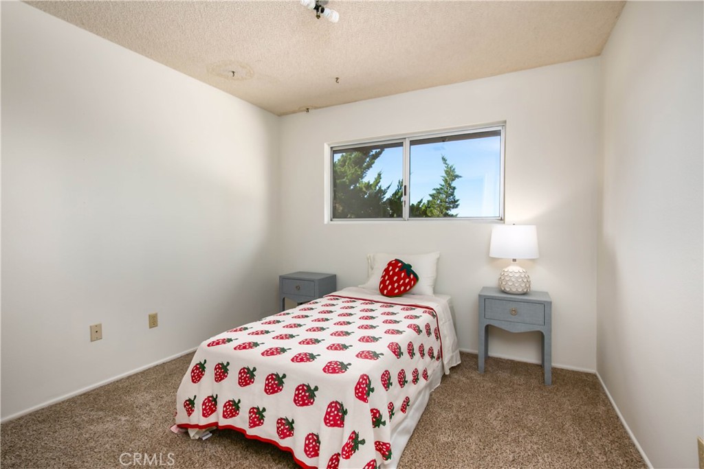46404 Kings Canyon Road Lancaster, CA 93536 - Photo 16 of 41 a bedroom with a bed and a painting on the wall