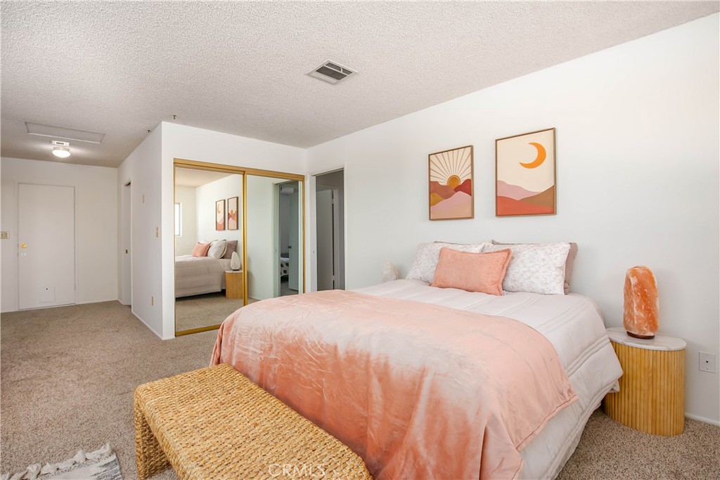 46404 Kings Canyon Road Lancaster, CA 93536 - Photo 19 of 41 a bedroom with a bed and a couch