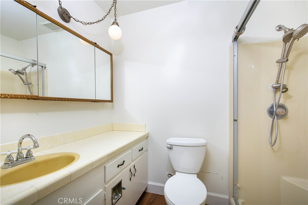 46404 Kings Canyon Road Lancaster, CA 93536 - Photo 21 of 41 a bathroom with a toilet sink and mirror