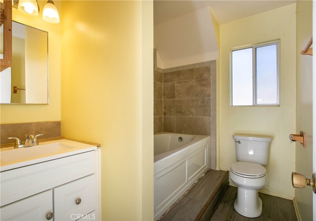 46404 Kings Canyon Road Lancaster, CA 93536 - Photo 29 of 41 a bathroom with a sink a toilet and shower