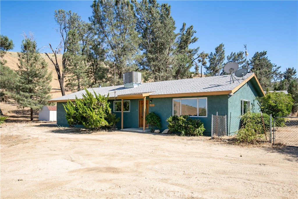 46404 Kings Canyon Road Lancaster, CA 93536 - Photo 34 of 41 a view of a house with a yard and potted plants