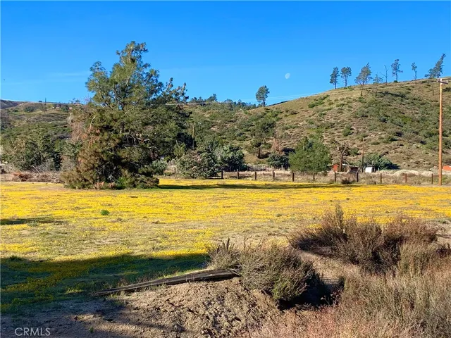 a view of a lake with houses in the back