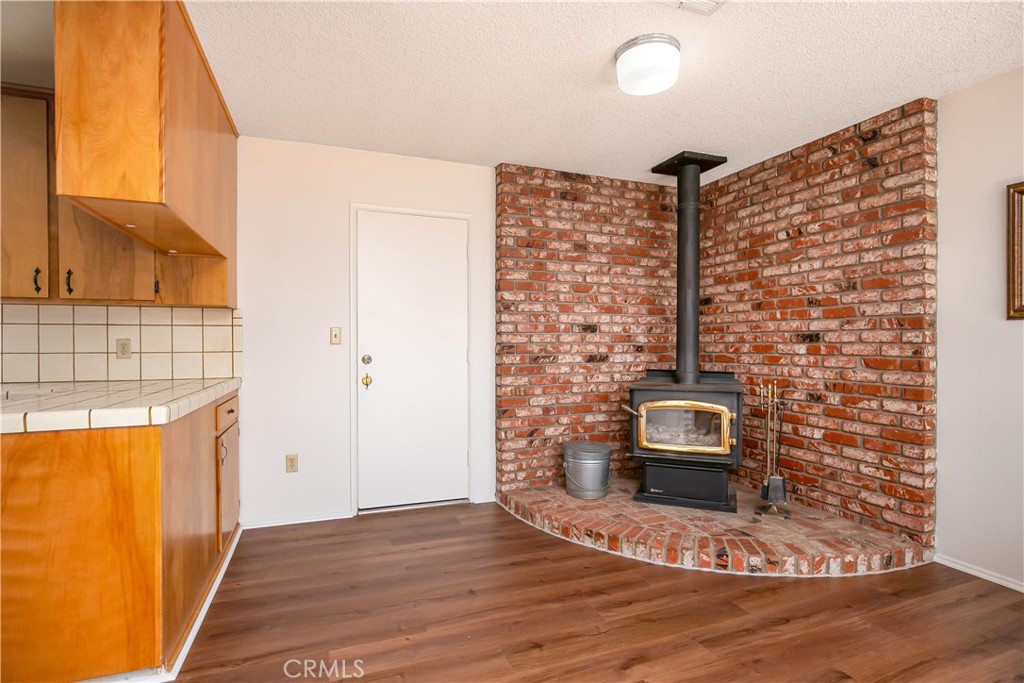 46404 Kings Canyon Road Lancaster, CA 93536 - Photo 8 of 41 a view of living room with furniture and a fireplace