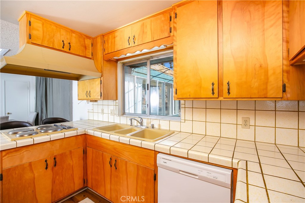 46404 Kings Canyon Road Lancaster, CA 93536 - Photo 9 of 41 a bathroom with a sink a vanity and a window