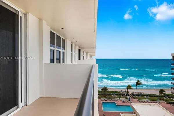 a view of swimming pool from a balcony