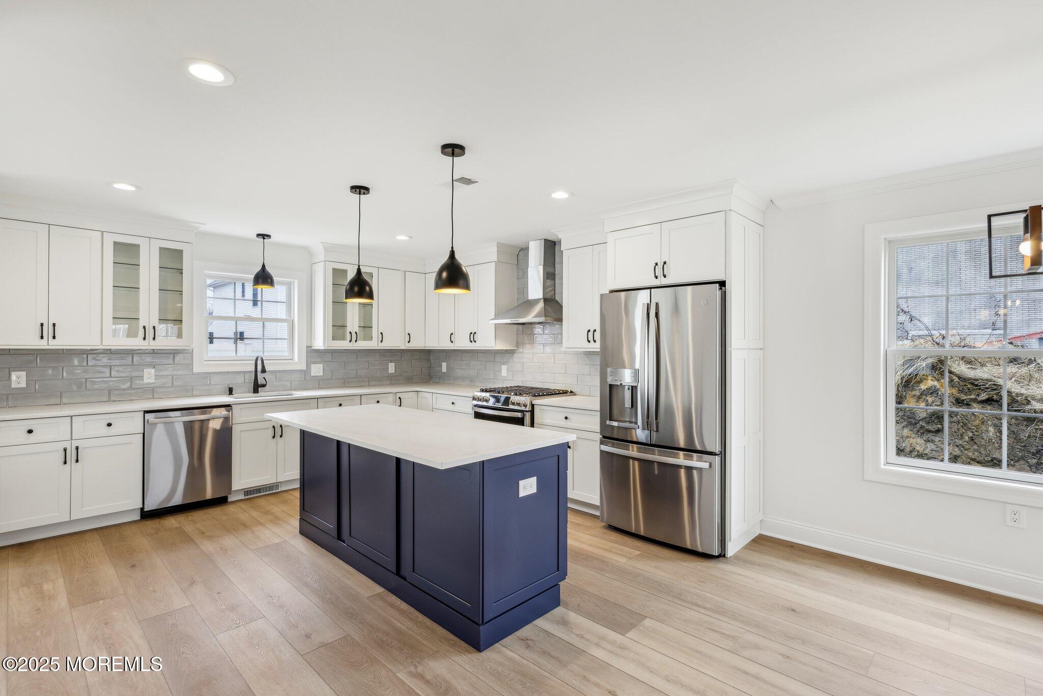 563 Holmdel Road Hazlet, NJ 07730 - Photo 11 of 50 a kitchen with stainless steel appliances granite countertop a sink stove and refrigerator