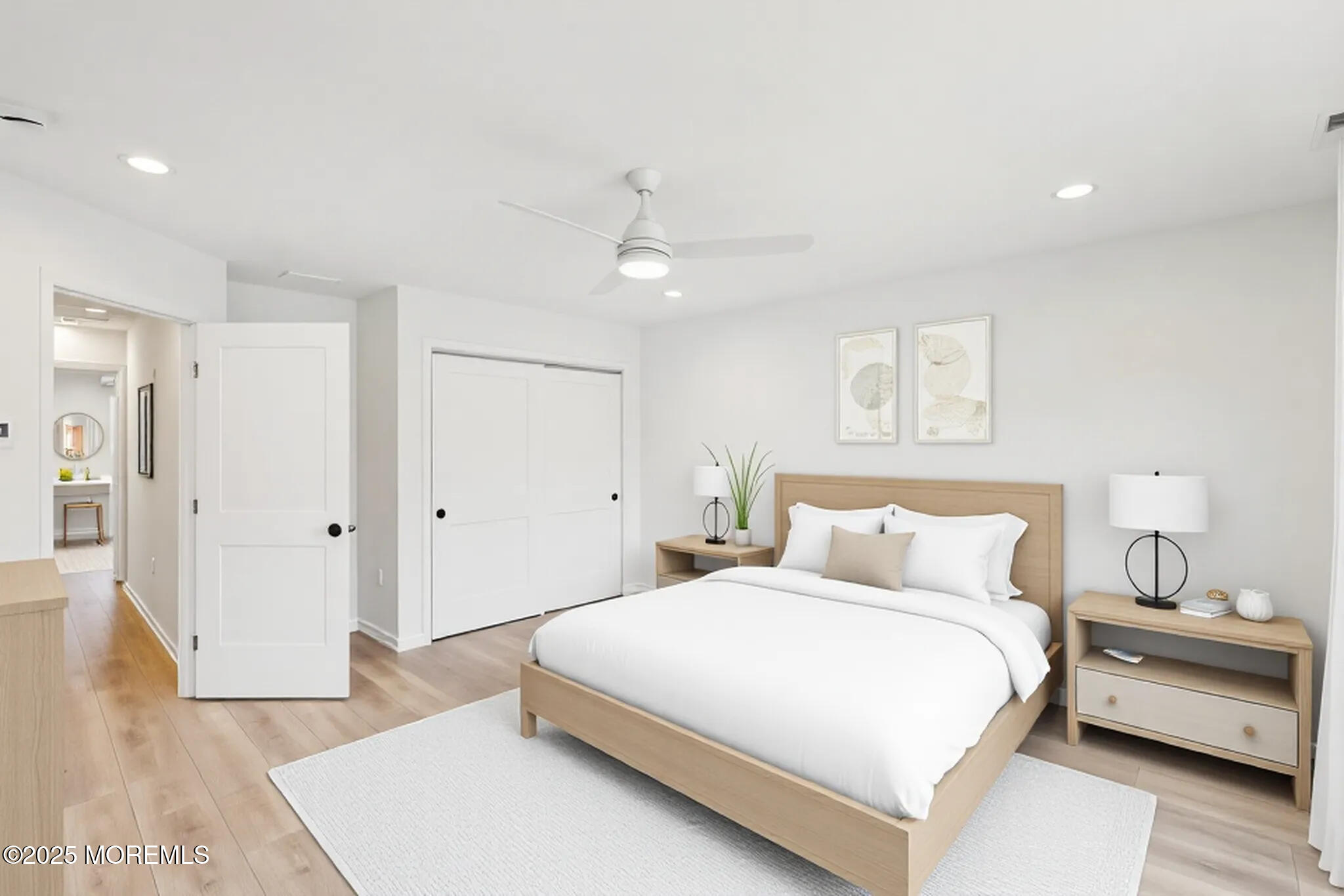 563 Holmdel Road Hazlet, NJ 07730 - Photo 19 of 50 a bedroom with a bed and a chandelier