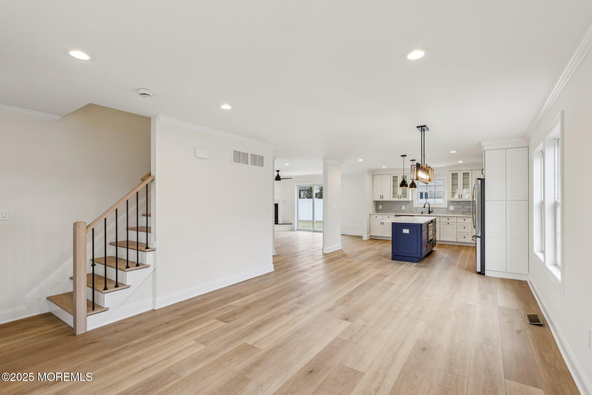 563 Holmdel Road Hazlet, NJ 07730 - Photo 2 of 50 a view of a room with wooden floor and windows