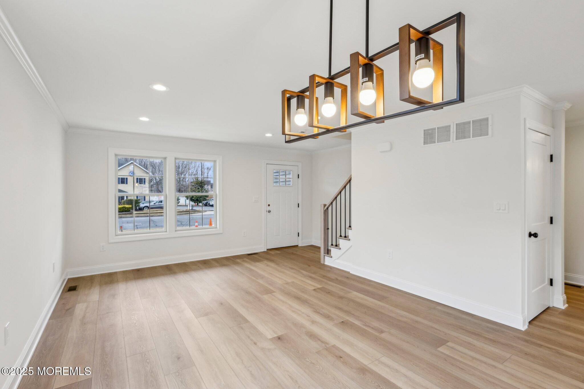 563 Holmdel Road Hazlet, NJ 07730 - Photo 3 of 50 a view of an entryway with wooden floor