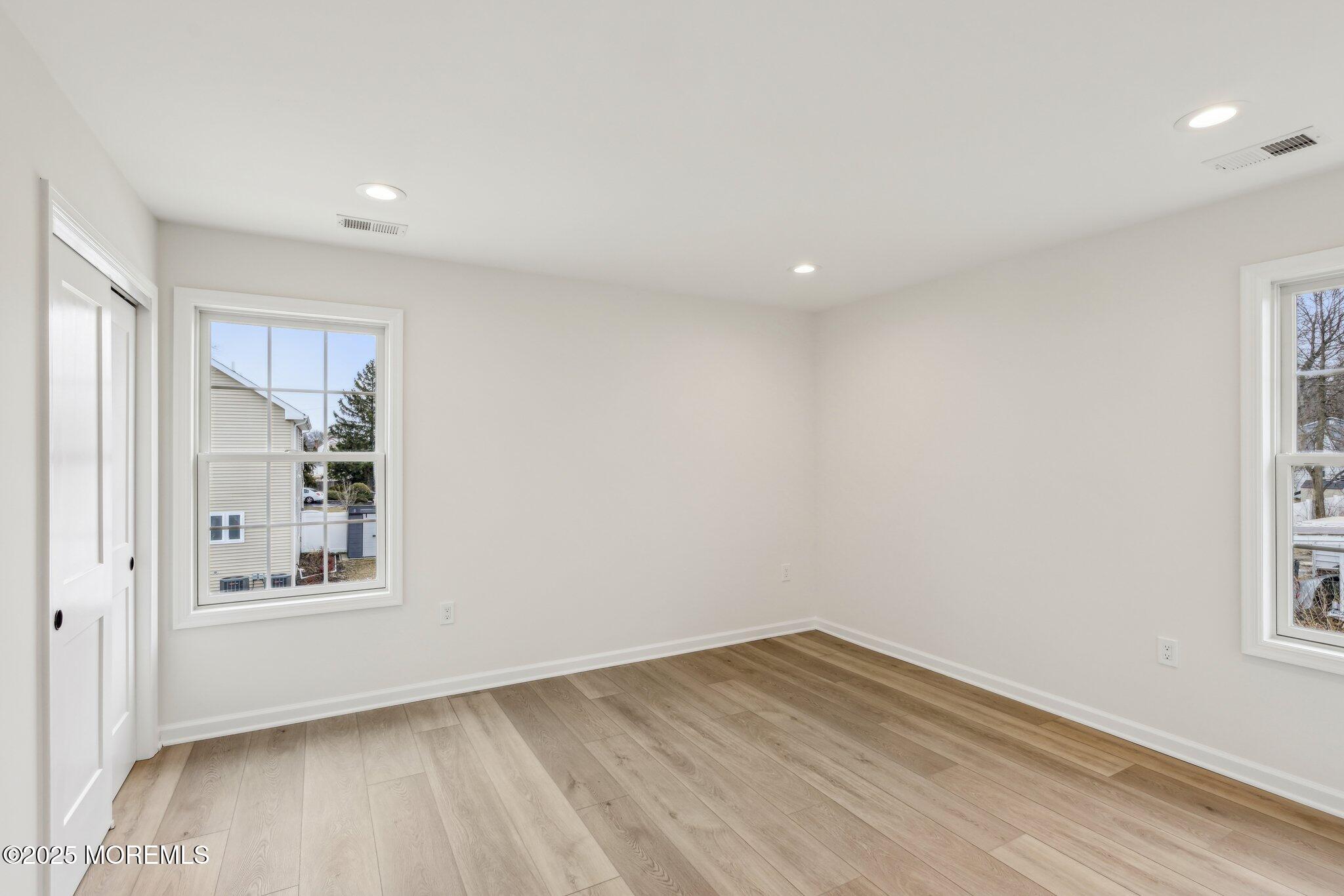 563 Holmdel Road Hazlet, NJ 07730 - Photo 33 of 50 wooden floor in an empty room with a window
