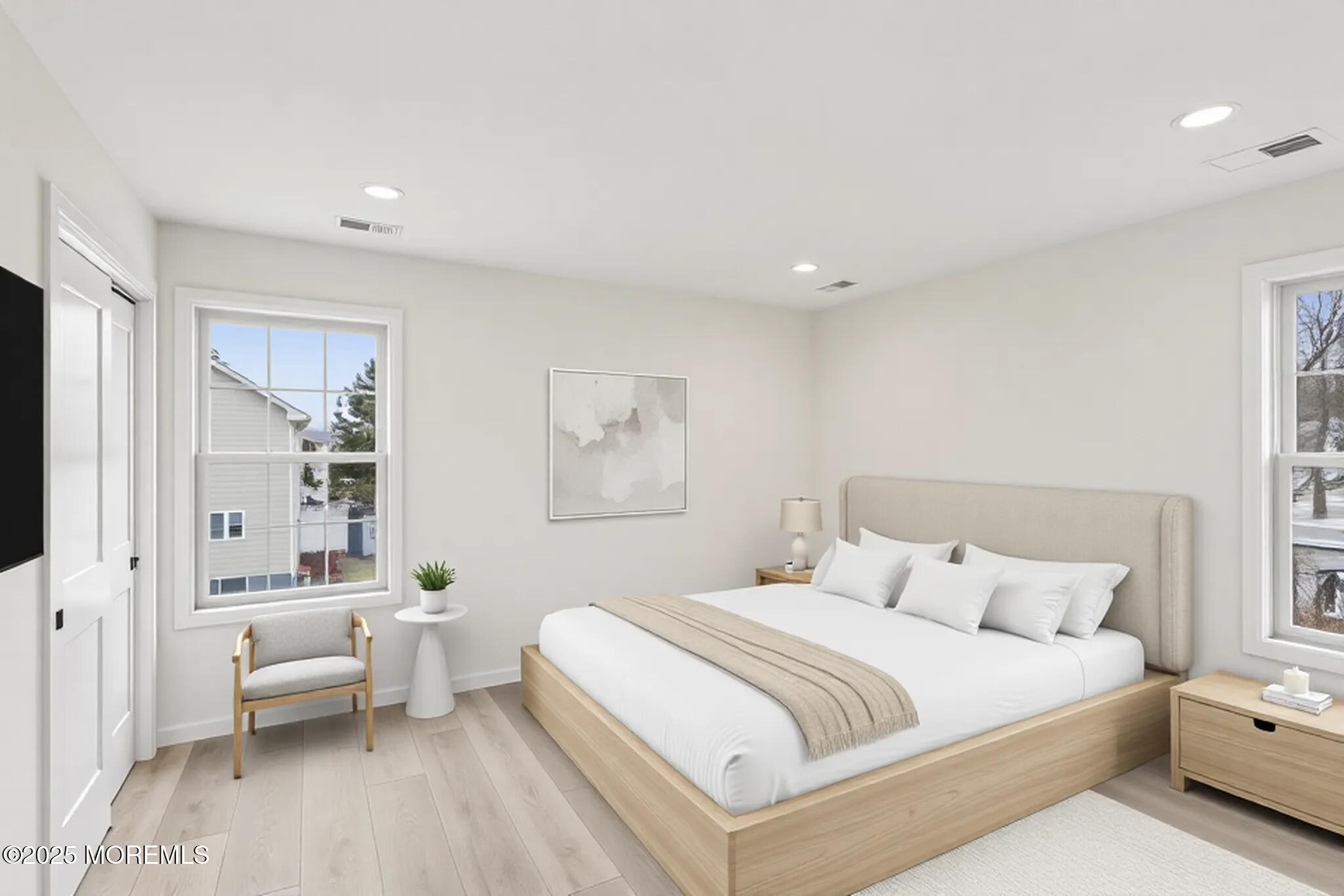 563 Holmdel Road Hazlet, NJ 07730 - Photo 34 of 50 a spacious bedroom with a bed and a couch