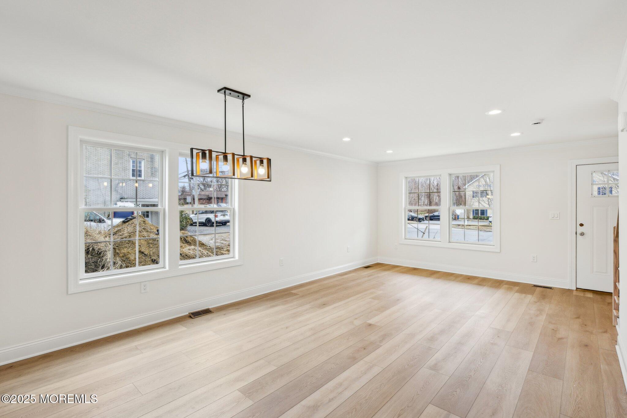 563 Holmdel Road Hazlet, NJ 07730 - Photo 5 of 50 wooden floor in an empty room with a window