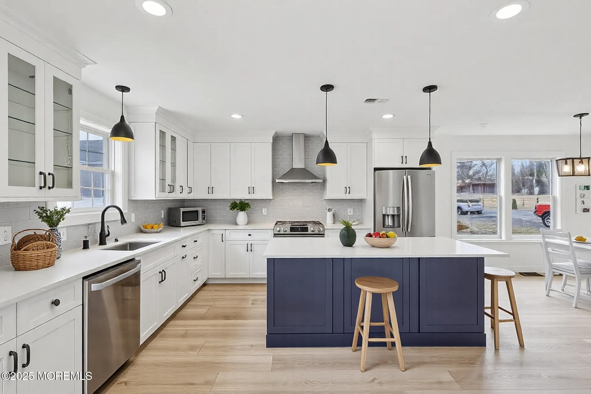 563 Holmdel Road Hazlet, NJ 07730 - Photo 9 of 50 a kitchen with stainless steel appliances kitchen island granite countertop a table chairs sink and cabinets