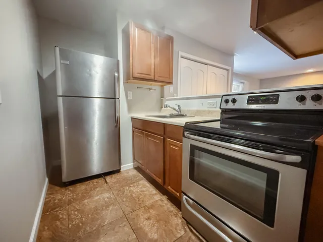 a kitchen with appliances and cabinets