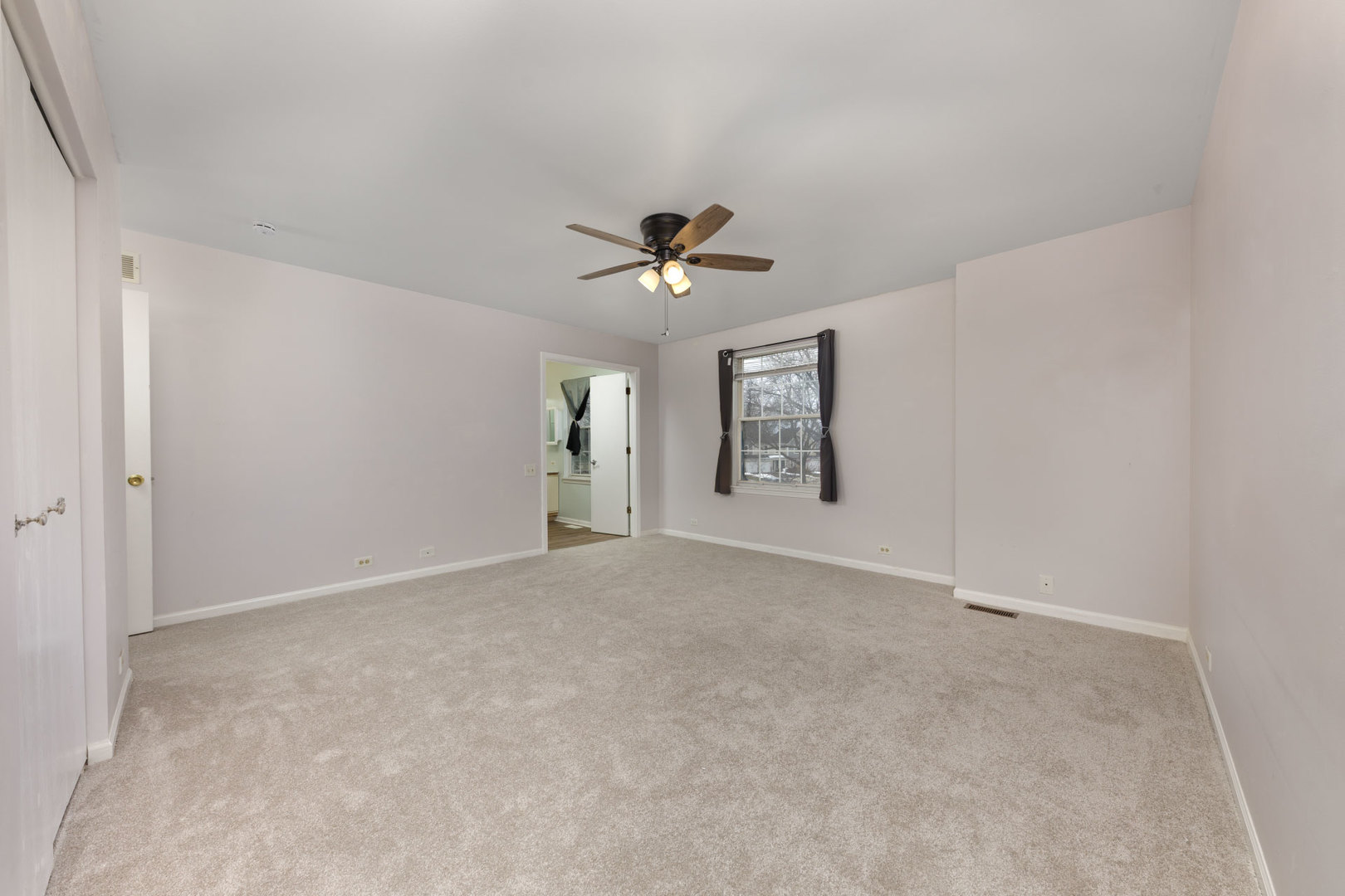 1604 Pebble Beach Circle Elgin, IL 60123 - Photo 19 of 37 an empty room with fan and windows