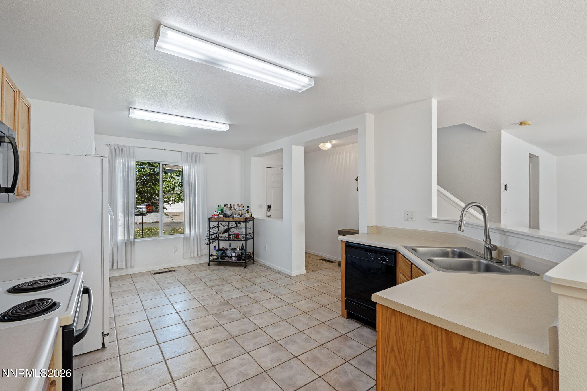 9490 Autumn Leaf Way Reno, NV 89506 - Photo 9 of 31 kithcen looking towards stairs