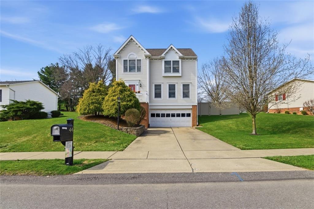 44 Rodgers Drive Coraopolis, PA 15108 - Photo 1 of 42 a front view of a house with a yard and a garage