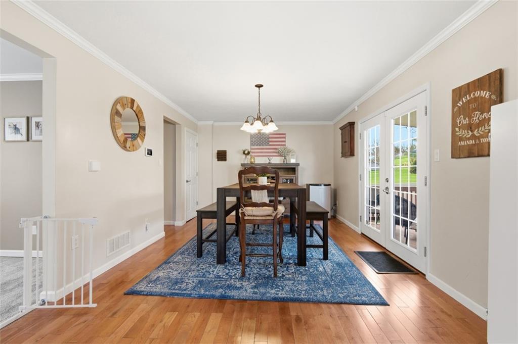44 Rodgers Drive Coraopolis, PA 15108 - Photo 13 of 42 a view of a dining room with furniture window and wooden floor
