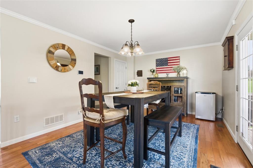 44 Rodgers Drive Coraopolis, PA 15108 - Photo 15 of 42 a view of a dining room with furniture and wooden floor