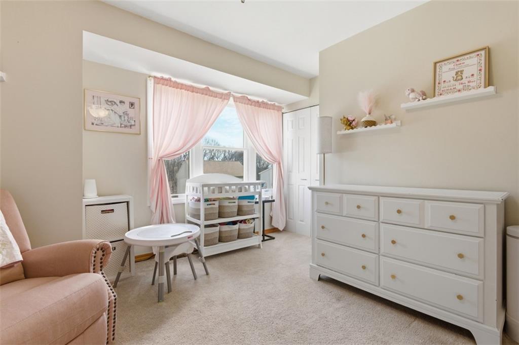 44 Rodgers Drive Coraopolis, PA 15108 - Photo 22 of 42 a living room with furniture a baby crib and a window