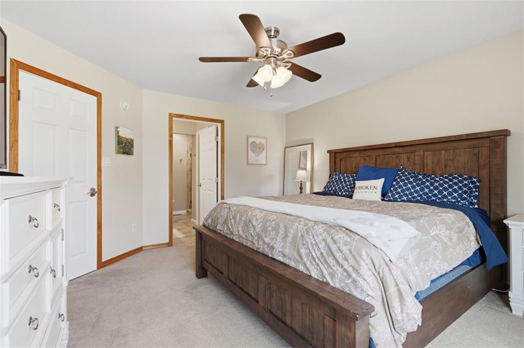 44 Rodgers Drive Coraopolis, PA 15108 - Photo 31 of 42 a bedroom with a large bed and a chandelier