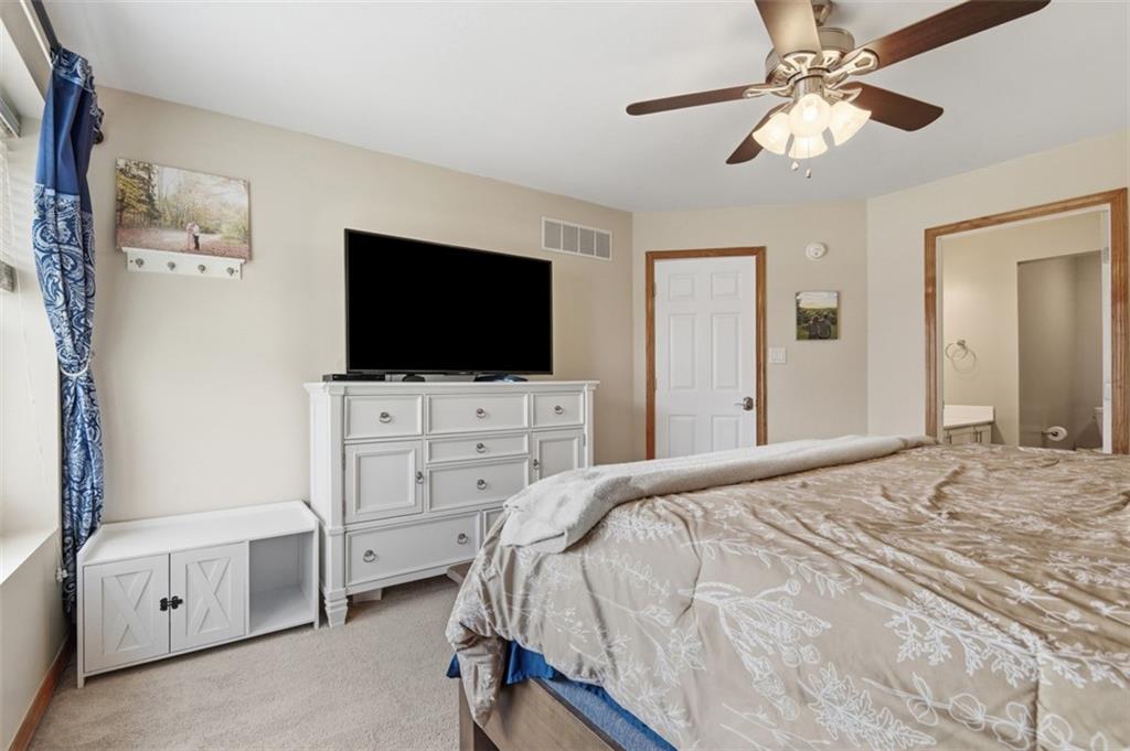44 Rodgers Drive Coraopolis, PA 15108 - Photo 32 of 42 a bedroom with a bed and a flat tv screen on dresser