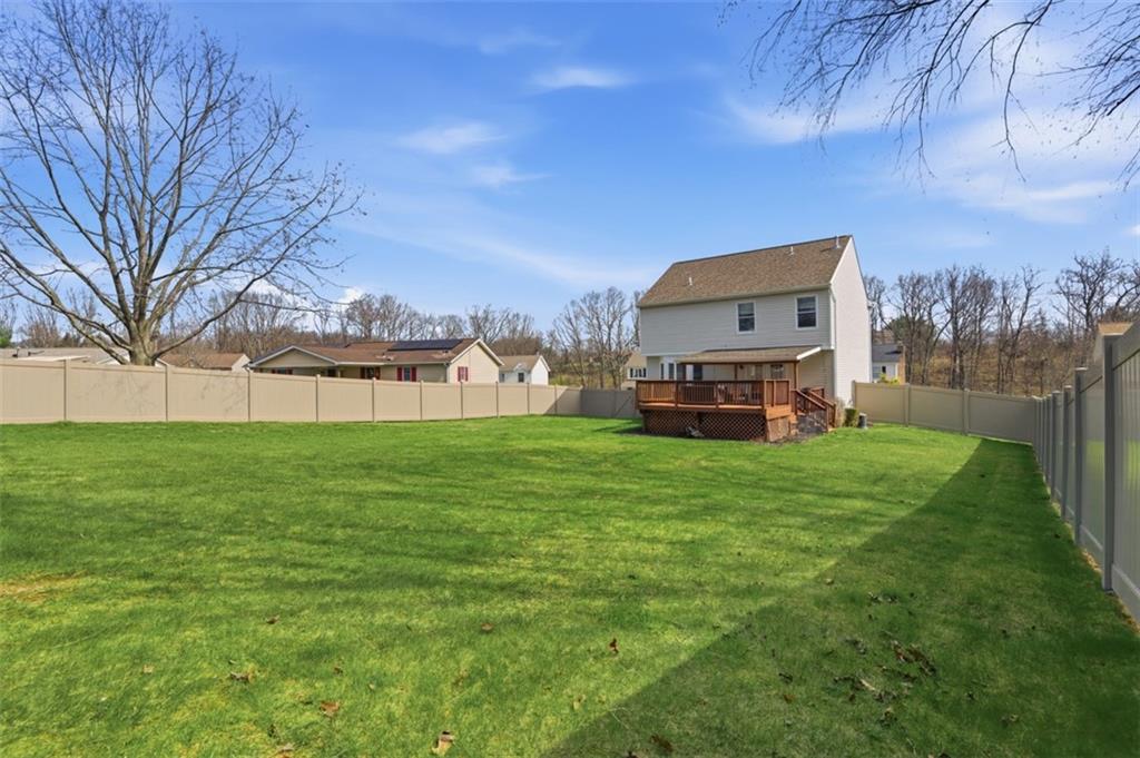44 Rodgers Drive Coraopolis, PA 15108 - Photo 40 of 42 a view of a big yard with a house in the background
