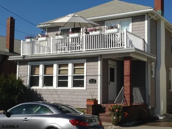 a front view of a house with a balcony