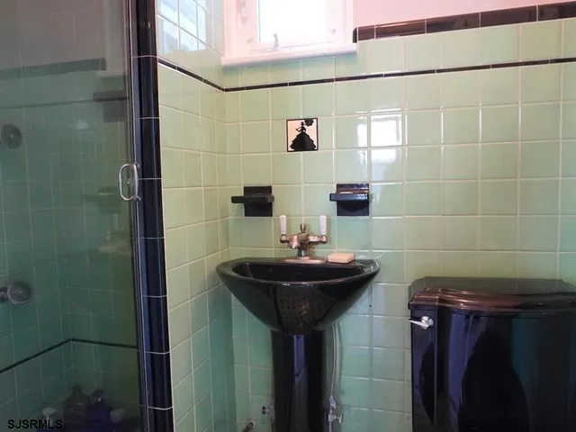 a bathroom with a sink and mirror