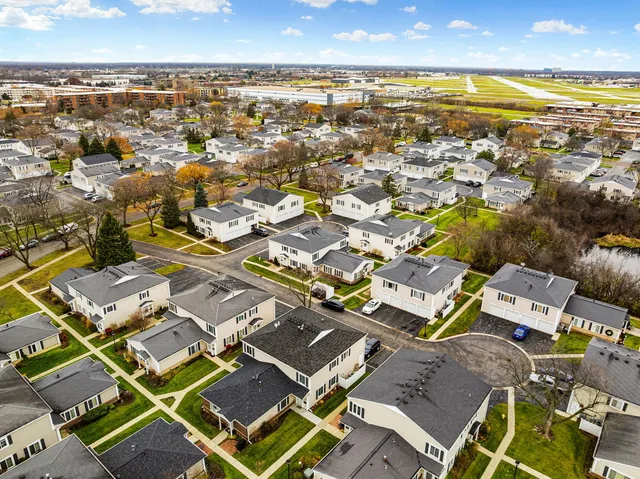 an aerial view of residential building with parking space