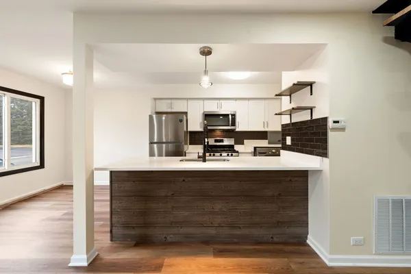 a view of living room with granite countertop furniture and fireplace